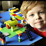 Kid Playing with LEGO blocks