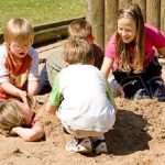Kids Playing At Sandbox