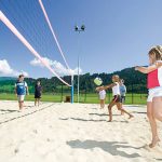 Kids playing Beach volleyball