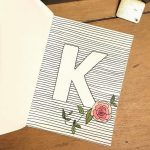 Simple letter with flower and lines