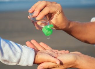 child-using-hand-sanitizer