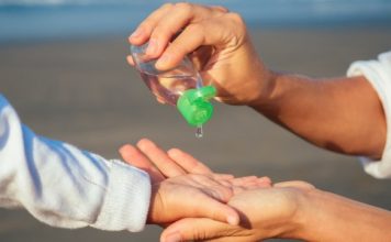 child-using-hand-sanitizer